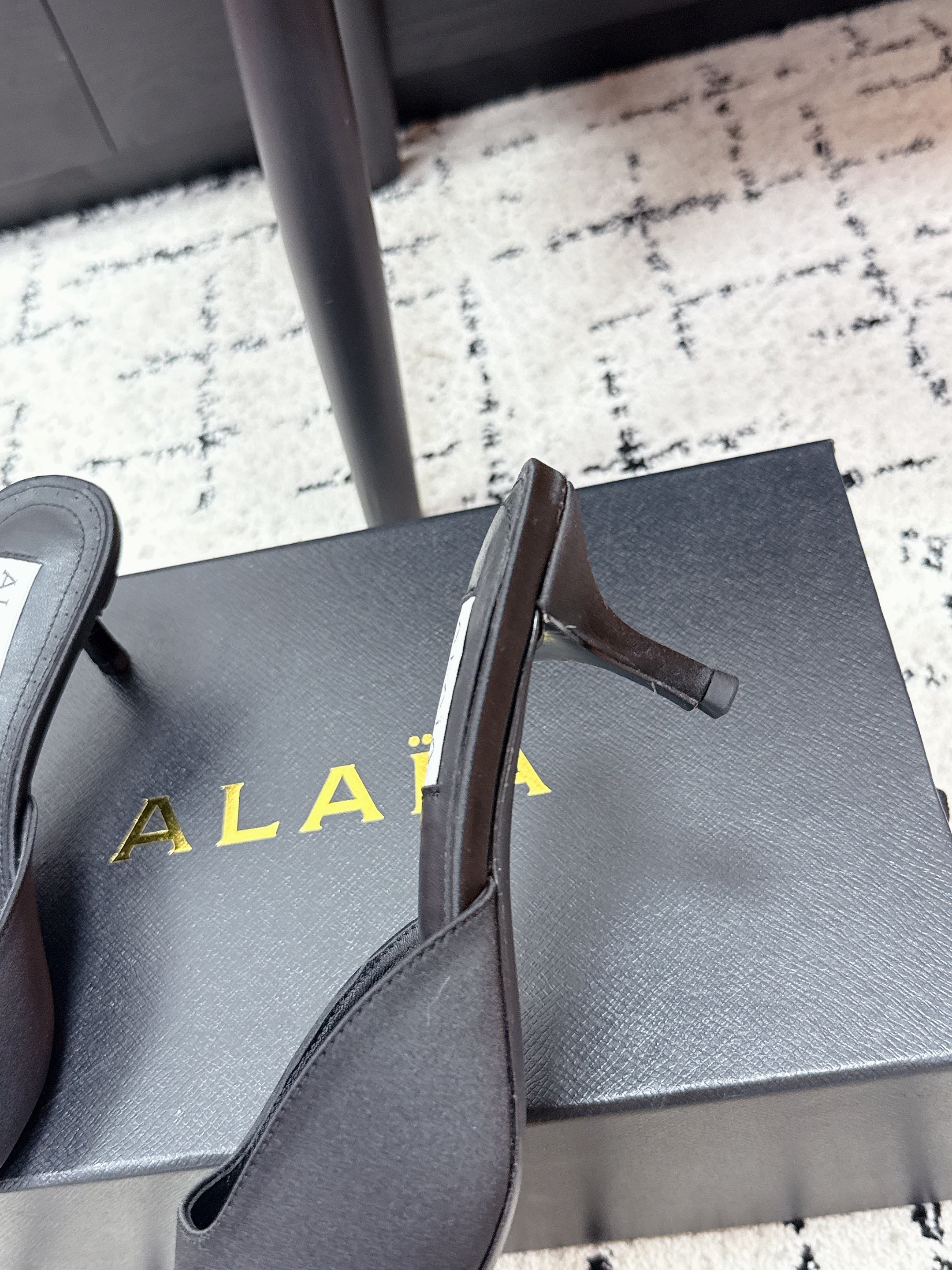 ALAIA 26S HEELED MULES 65 MM IN BLACK SATIN
