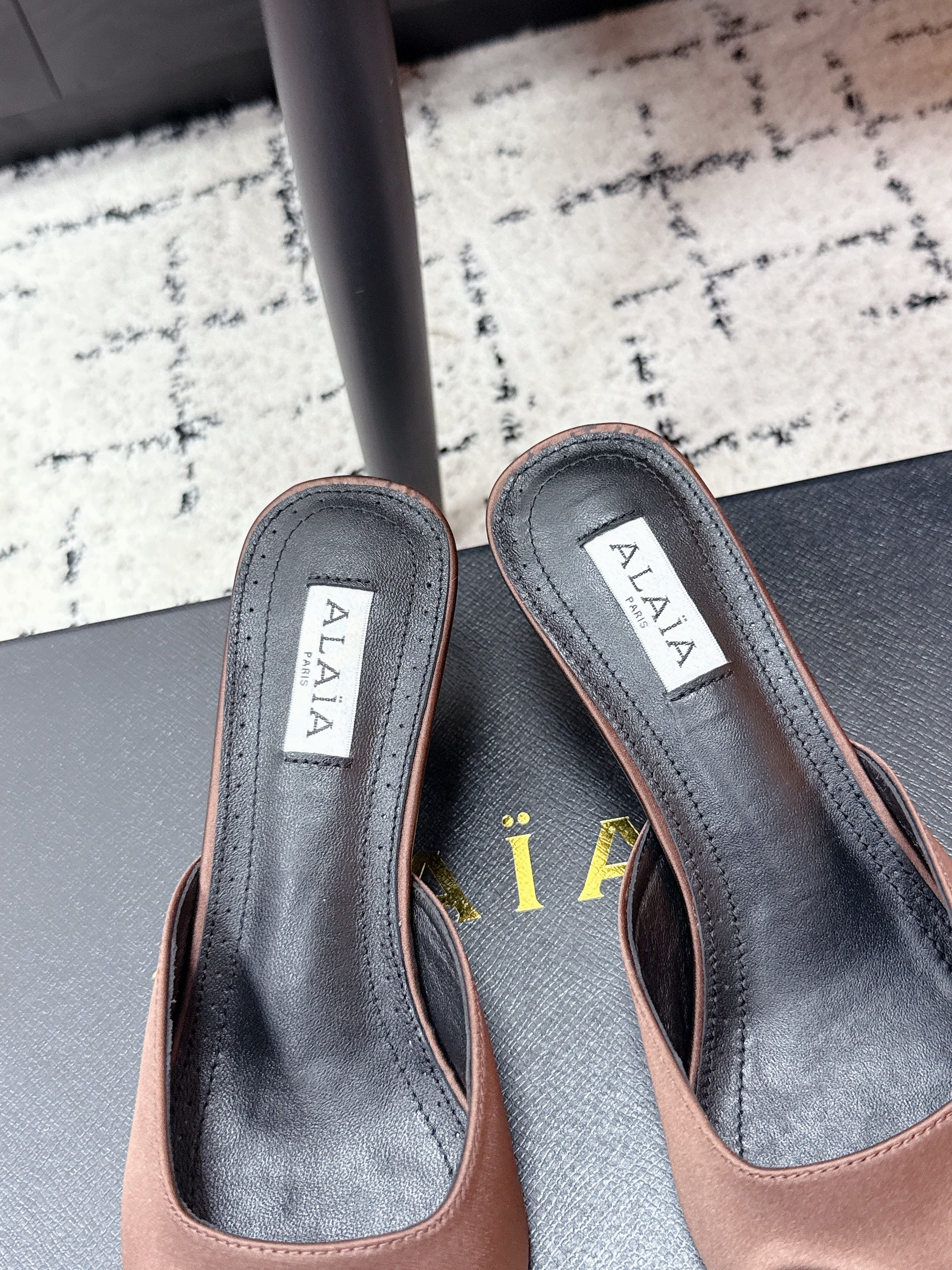 ALAIA 26S HEELED MULES 65 MM IN CHOCOLATE BROWN SATIN