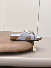 LOEWE 26S FLAT SANDALS IN LIGHT BLUE LOGO GOLD HARDWARE