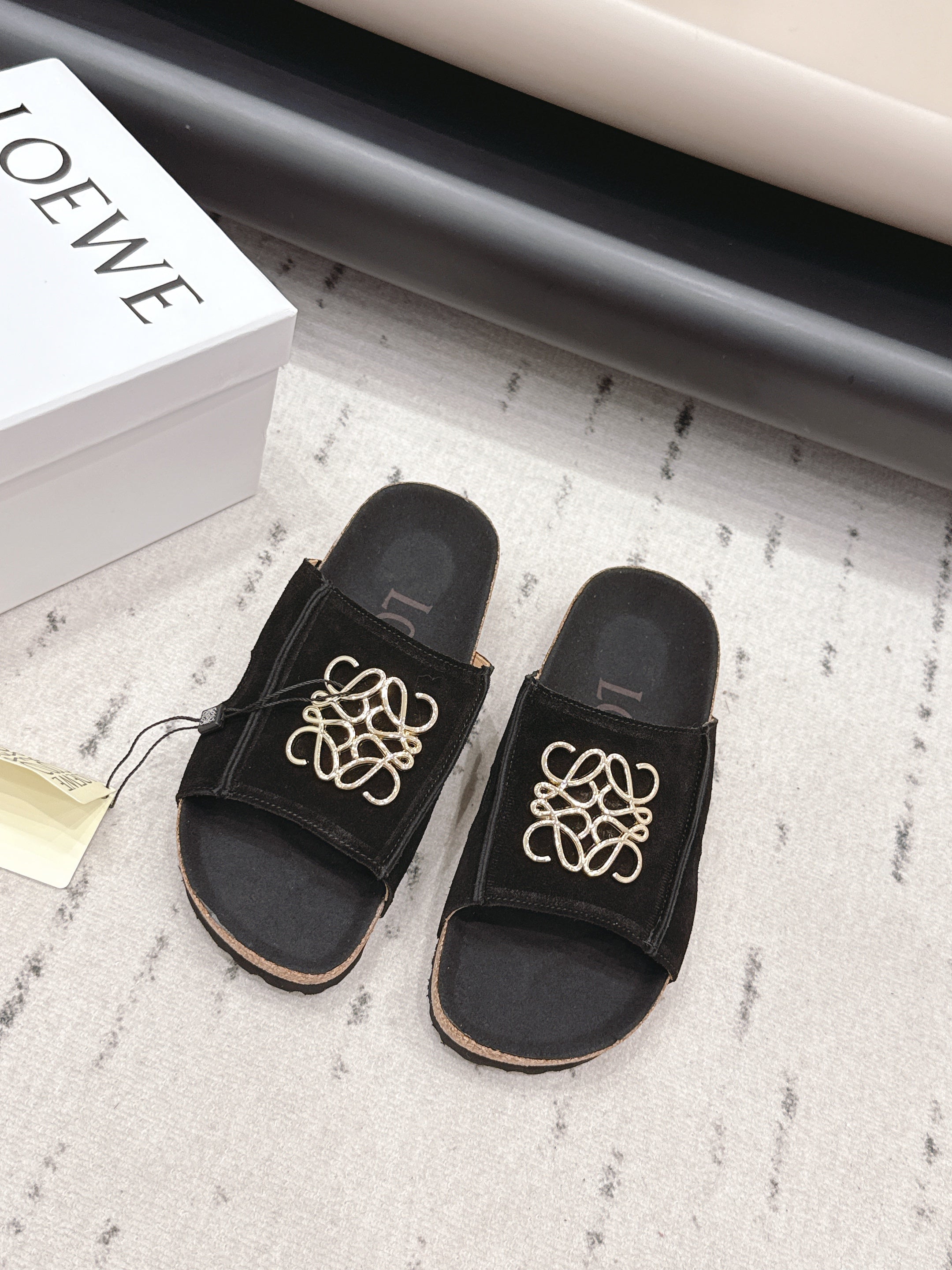 LOEWE 26S FLAT SANDALS IN BLACK LOGO GOLD HARDWARE
