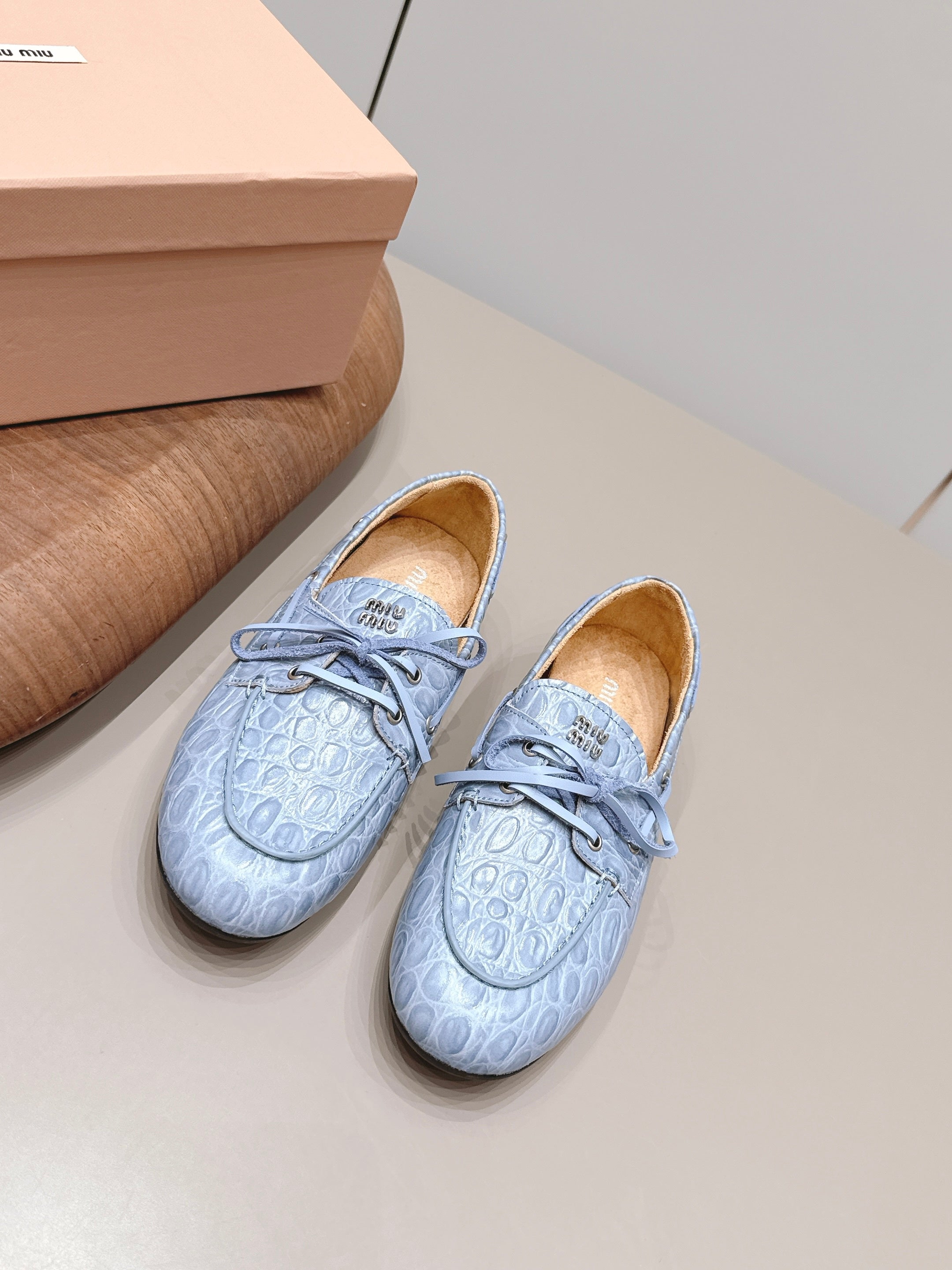 MIUMIU 26S BOAT SHOES IN BLUE EMBOSSED CALFSKIN