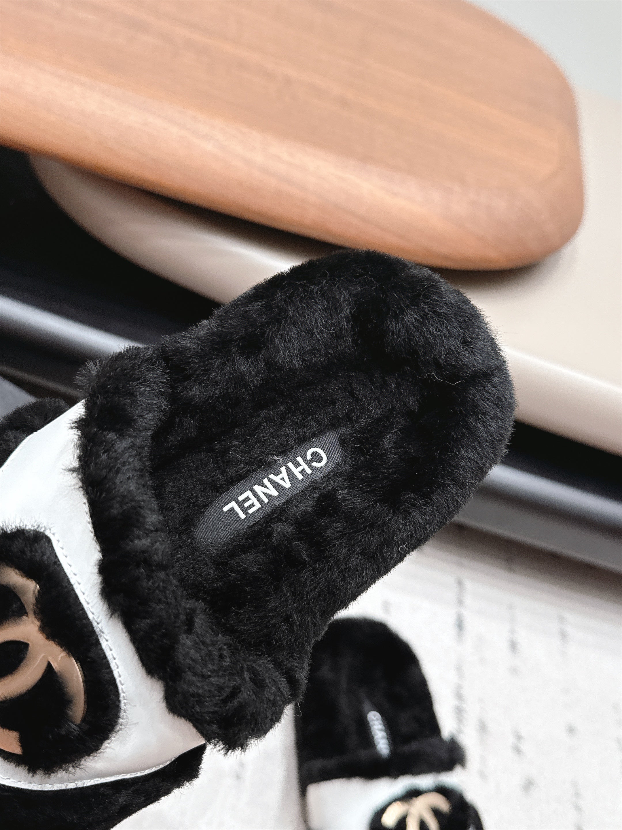 CHANEL 26S SLIDE SANDALS IN BLACK SHEARLING AND WHITE STRAP