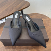 ALAIA 26S HEELED MULES 50 MM IN BLACK FABRIC