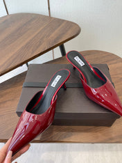 ALAIA 26S HEELED MULES 50 MM IN DARK RED GLOSSY CALFSKIN