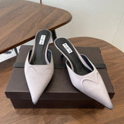 ALAIA 26S HEELED MULES 50 MM IN LAVENDER GREY FABRIC