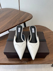 ALAIA 26S HEELED MULES 50 MM IN WHITE FABRIC