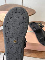 MIUMIU 26S FLIP FLOPS IN BLACK CALFSKIN