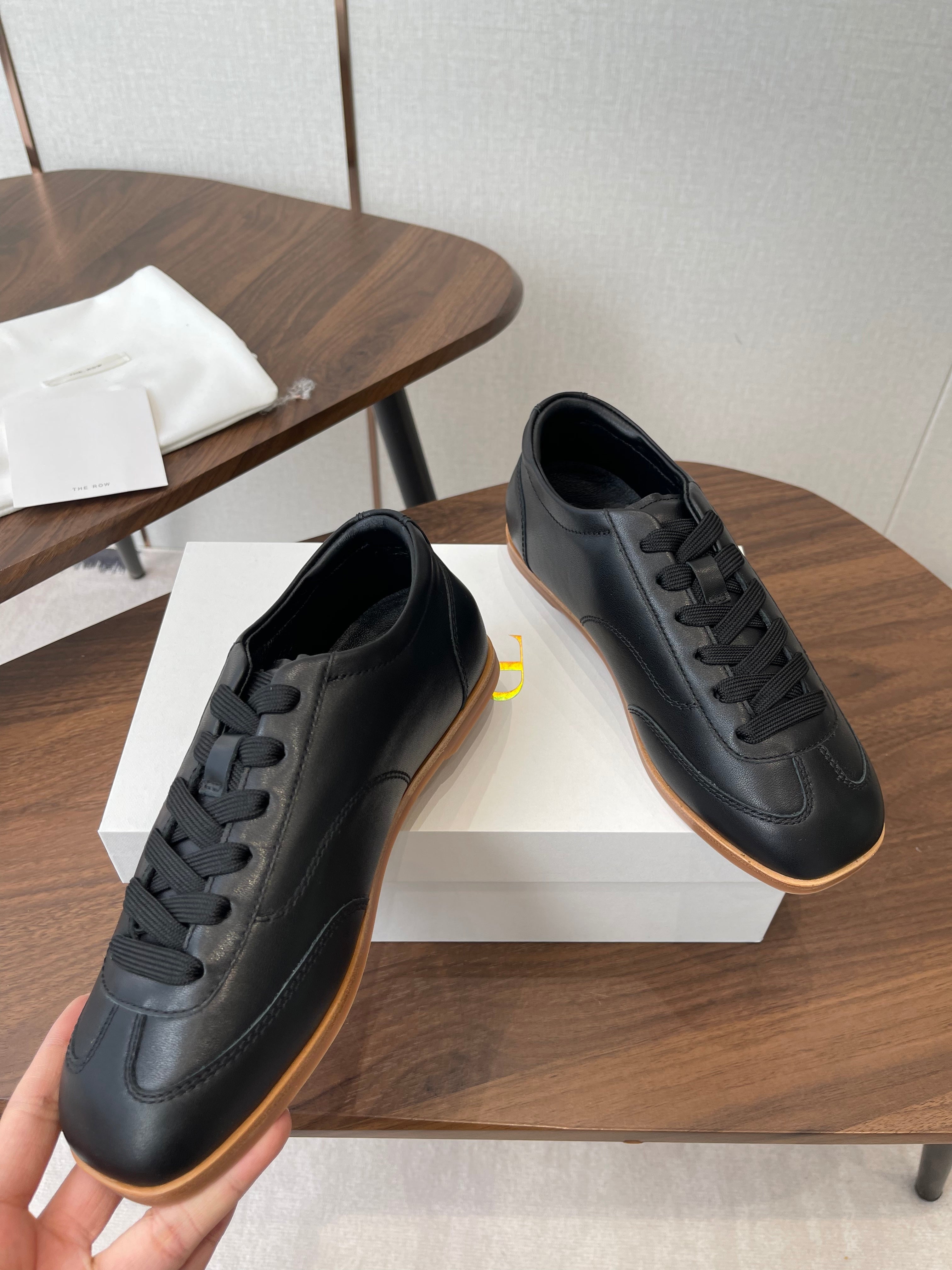 THE ROW 26S SNEAKERS IN BLACK CALFSKIN
