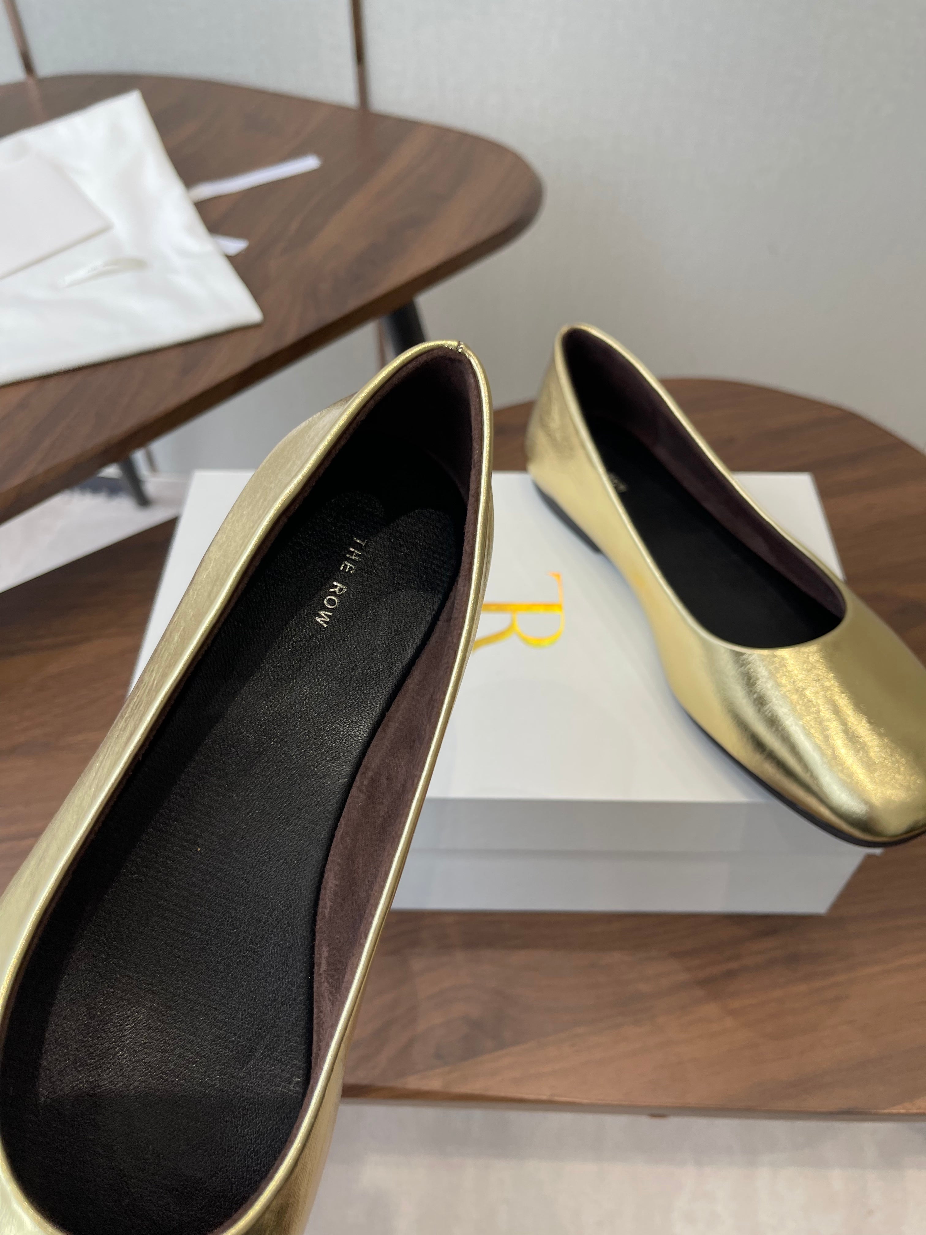 THE ROW 26S FLATS IN GOLD CALFSKIN