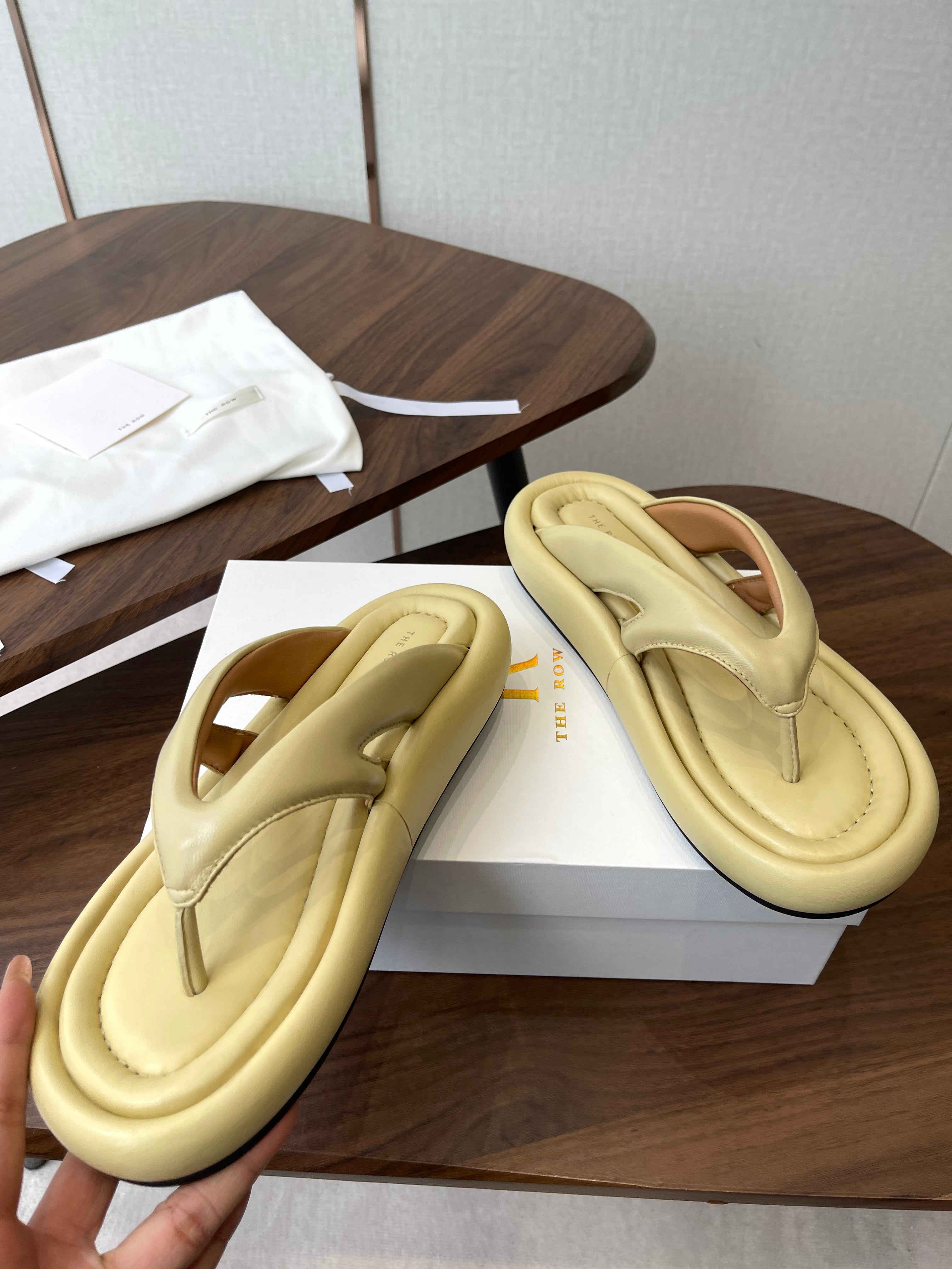 THE ROW 26S PUFFED THONG SANDALS IN BUTTER YELLOW CALFSKIN