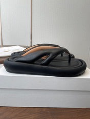 THE ROW 26S PUFFED THONG SANDALS IN BLACK CALFSKIN