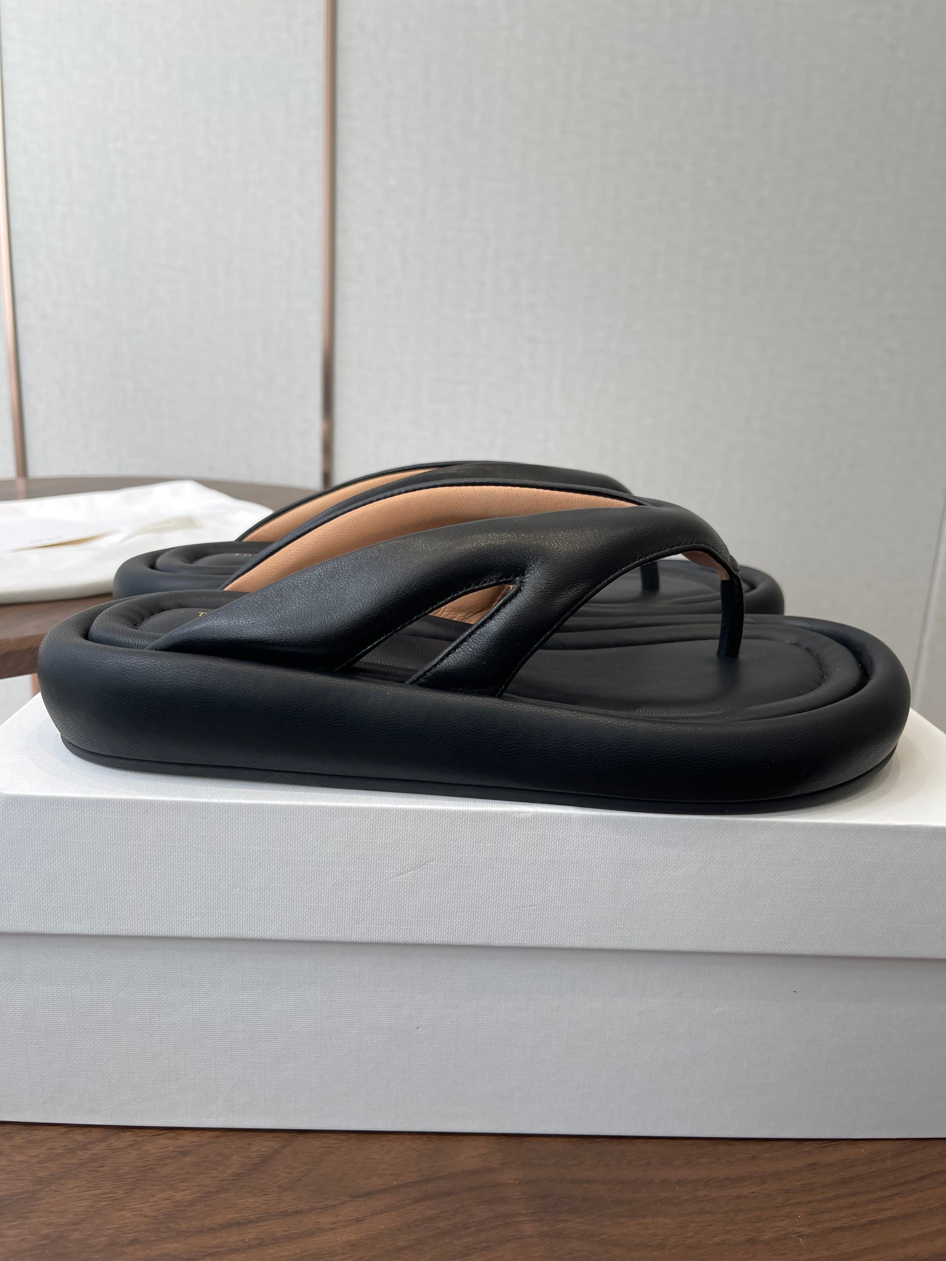 THE ROW 26S PUFFED THONG SANDALS IN BLACK CALFSKIN