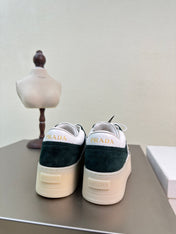 PRADA 26S DOWNTOWN THICK SOLE SNEAKERS IN WHITE CALFSKIN AND BLACK SUEDE