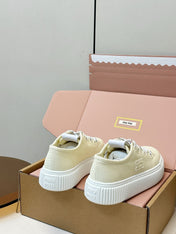 MIUMIU 26S PLATFORM SNEAKERS IN LIGHT YELLOW CANVAS