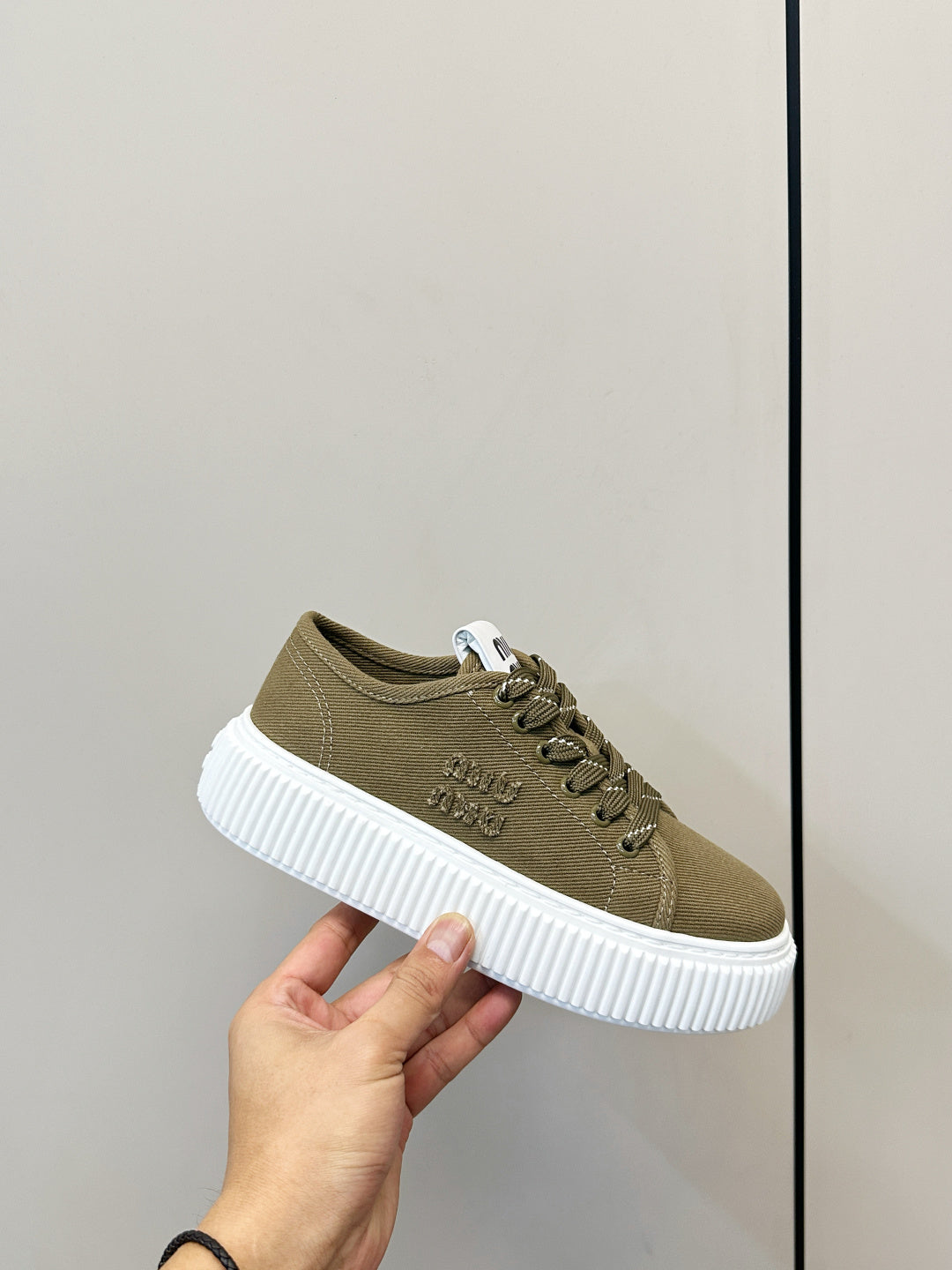 MIUMIU 26S PLATFORM SNEAKERS IN OLIVE GREEN CANVAS