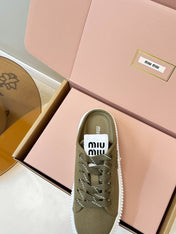 MIUMIU 26S SNEAKER MULES IN OLIVE GREEN CANVAS
