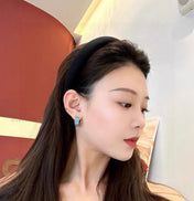 MIUMIU 26S LOGO HUGGIE HOOP EARRINGS IN LIGHT BLUE ENAMEL AND SILVER TONE METAL 622799
