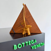 BOTTEGA VENETA 25S DOG CHARM IN BURNT ORANGE CALFSKIN