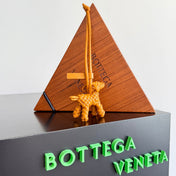 BOTTEGA VENETA 25S DOG CHARM IN BURNT ORANGE CALFSKIN