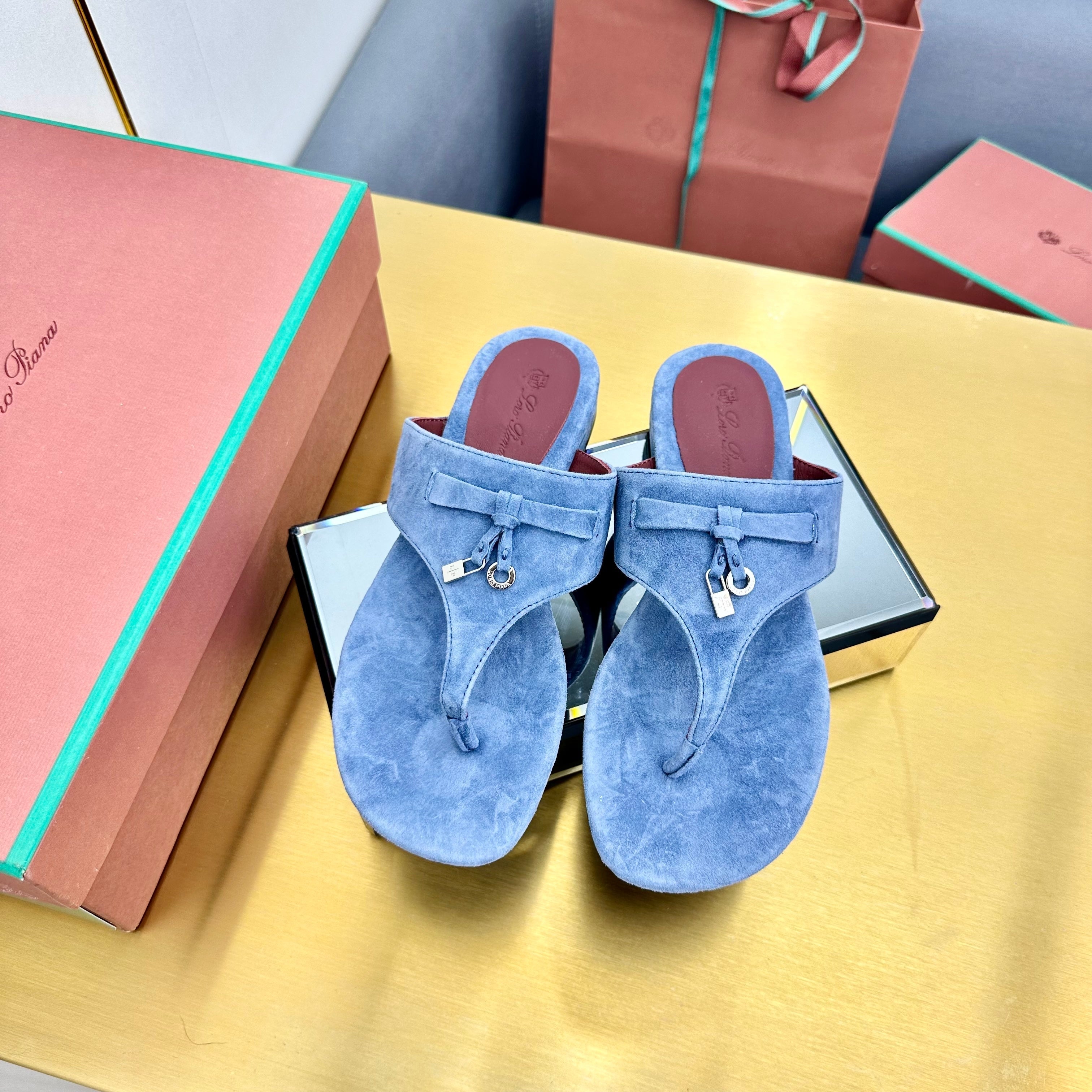 FLIP FLOPS IN BLUE SUEDE AND HARDWARE SILVER