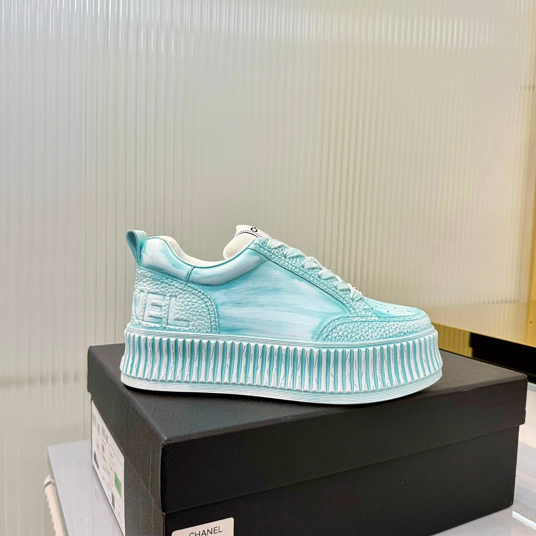 CHANEL 26S LOW-TOP SNEAKERS IN LIGHT MINT BLUE GRAFFITI PATTERN CALFSKIN