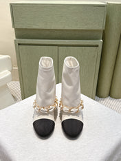 CHANEL 25S CALF-LENGTH BOOTS 45MM IN WHITE AND BLACK CALFSKIN GOLD HARDWARE
