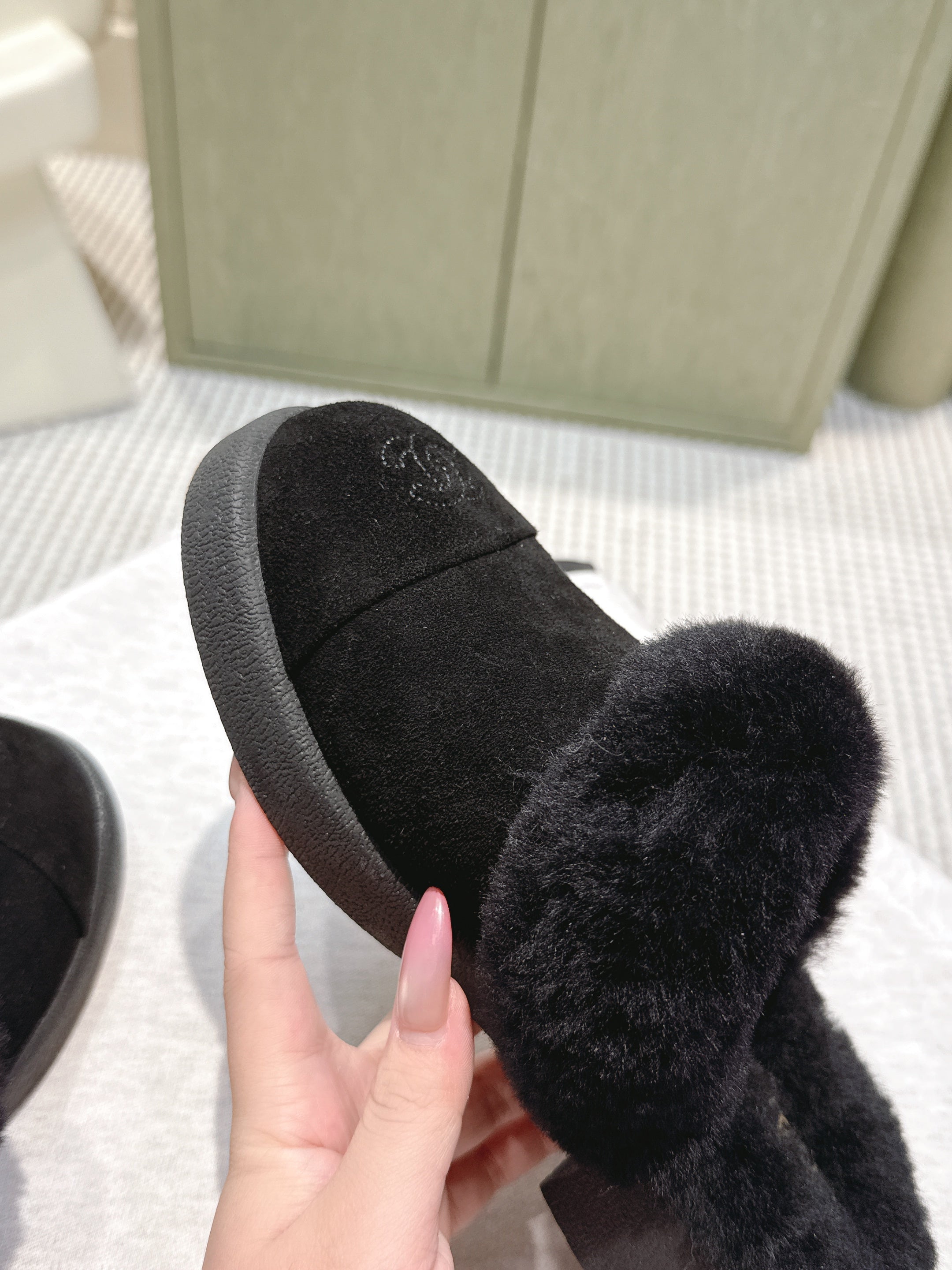 CHANEL 25S FUR-LINED MULES IN BLACK SUEDE