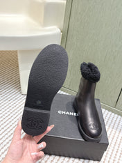 CHANEL 25S CALF-HIGH BOOTS IN BLACK CALFSKIN LINED WITH SHEEPSKIN