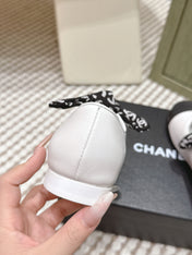 CHANEL 25S MARY JANES IN WHITE AND BLACK SHEARLING AND GROS GRAIN
