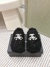 CHANEL 25S CLASSIC FURRY SLIDES IN BLACK WITH DOUBLE C LOGO