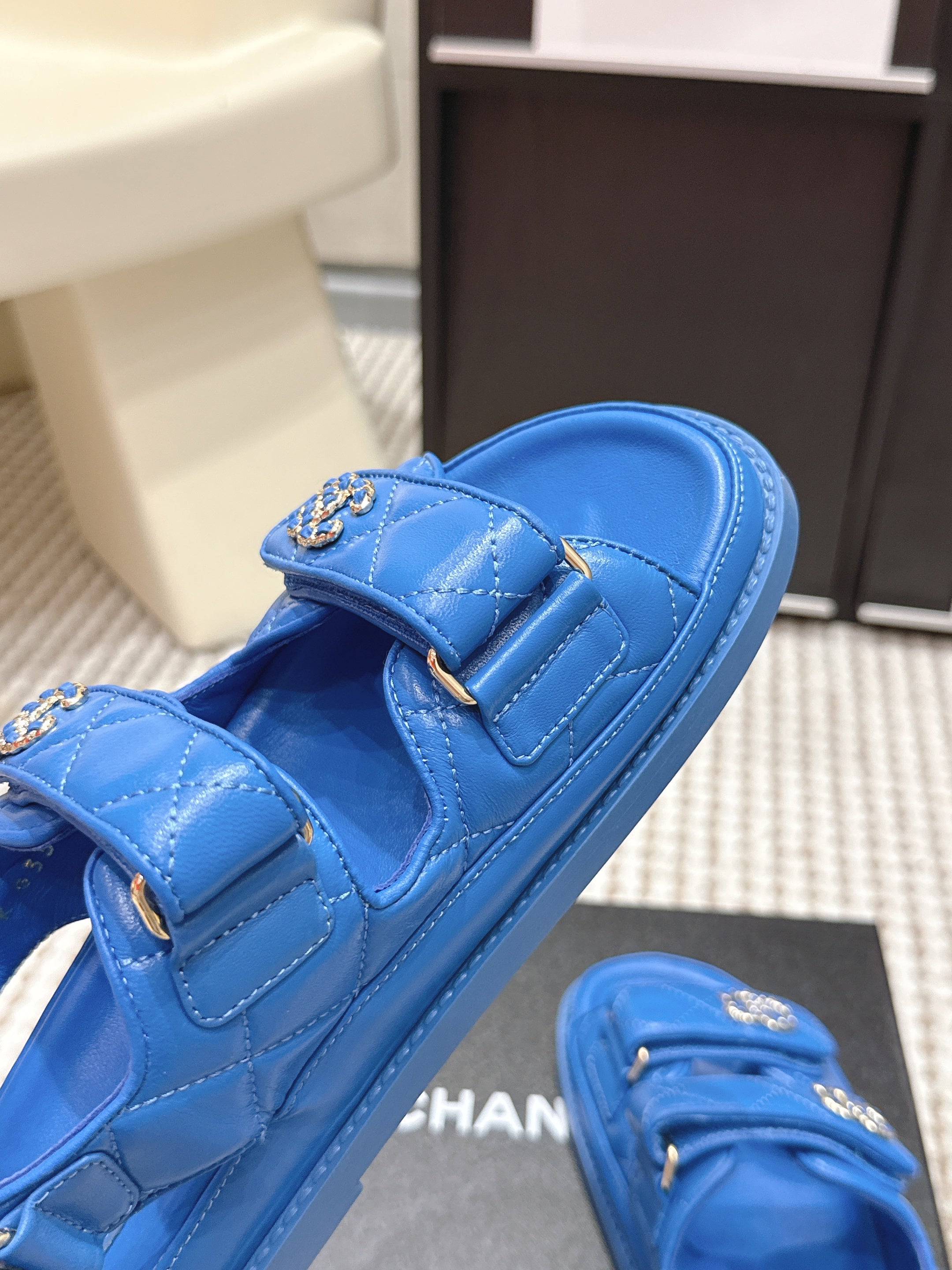 CHANEL 26S QUILTED DAD SANDALS IN BLUE CALFSKIN