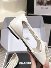 CHANEL 26S ROUND TOE MARY JANE FLATS IN OFF WHITE CUTOUT CALFSKIN WITH BLACK PATENT TOE
