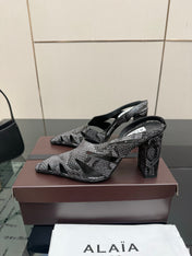 ALAIA 26S HEELED SLINGBACKS IN BLACK PYTHON-EMBOSSED LEATHER