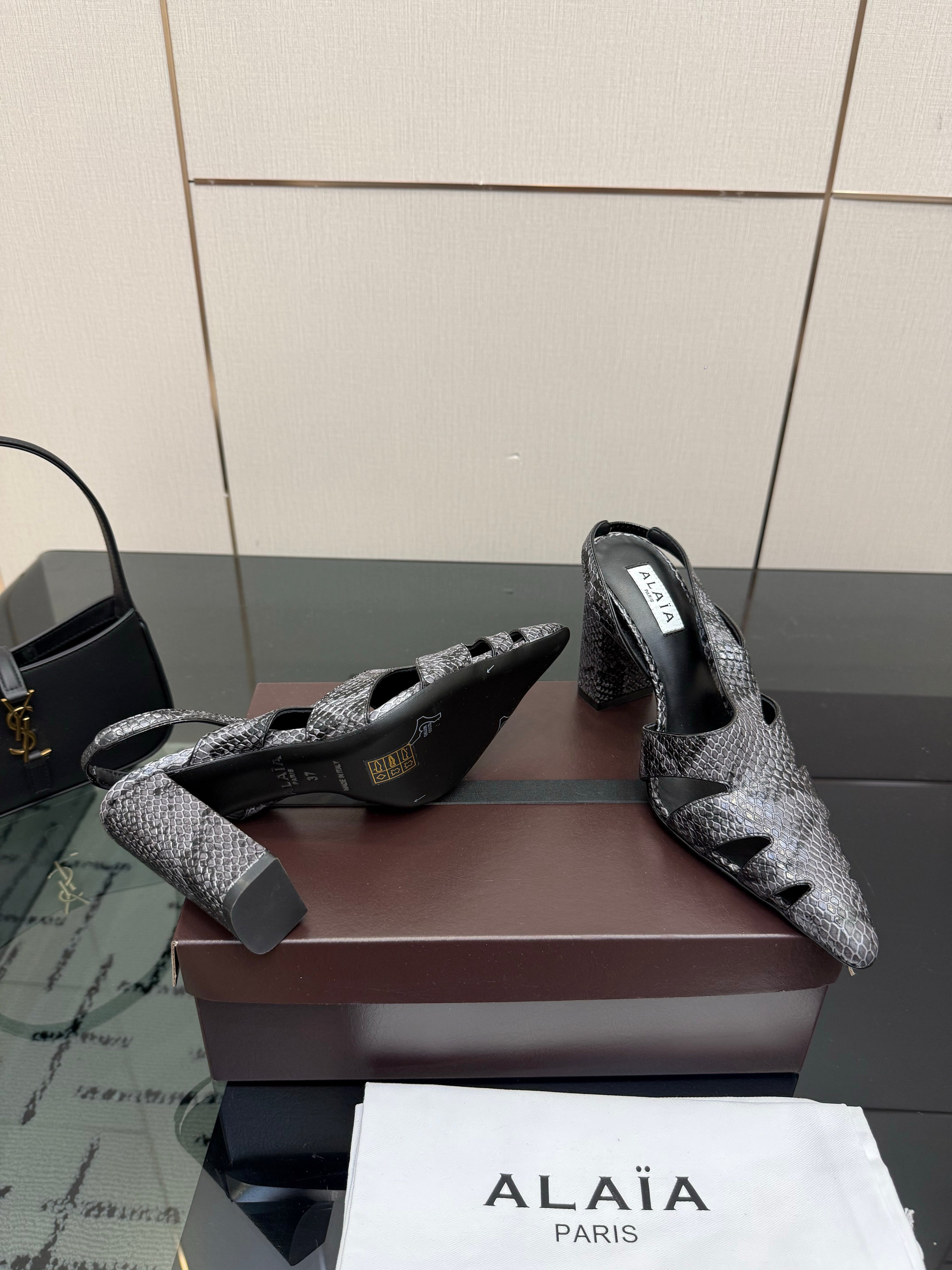 ALAIA 26S HEELED SLINGBACKS IN BLACK PYTHON-EMBOSSED LEATHER