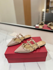 VALENTINO 26S STUDDED FLAT MULES IN NUDE PATENT CALFSKIN