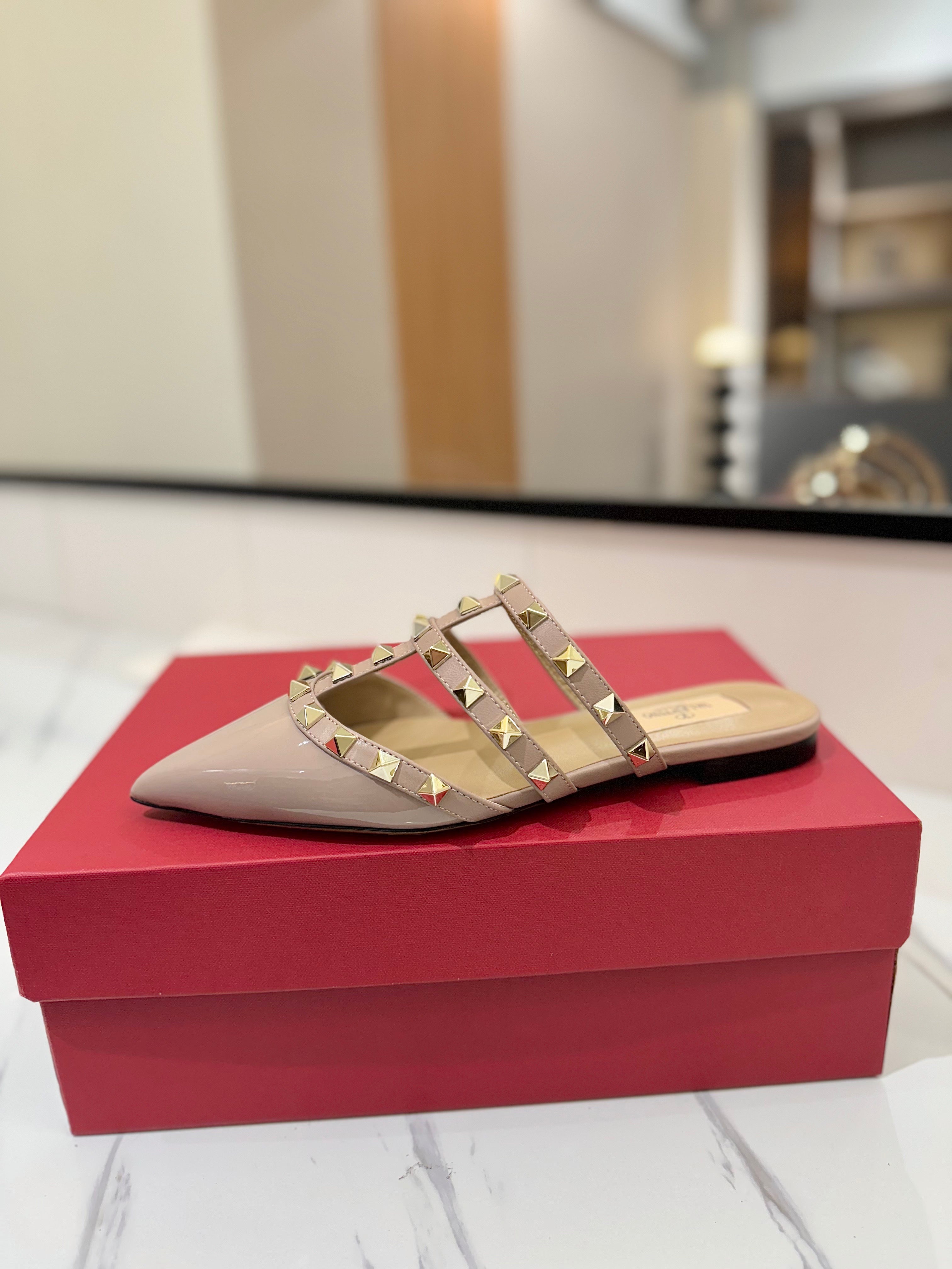 VALENTINO 26S STUDDED FLAT MULES IN NUDE PATENT CALFSKIN