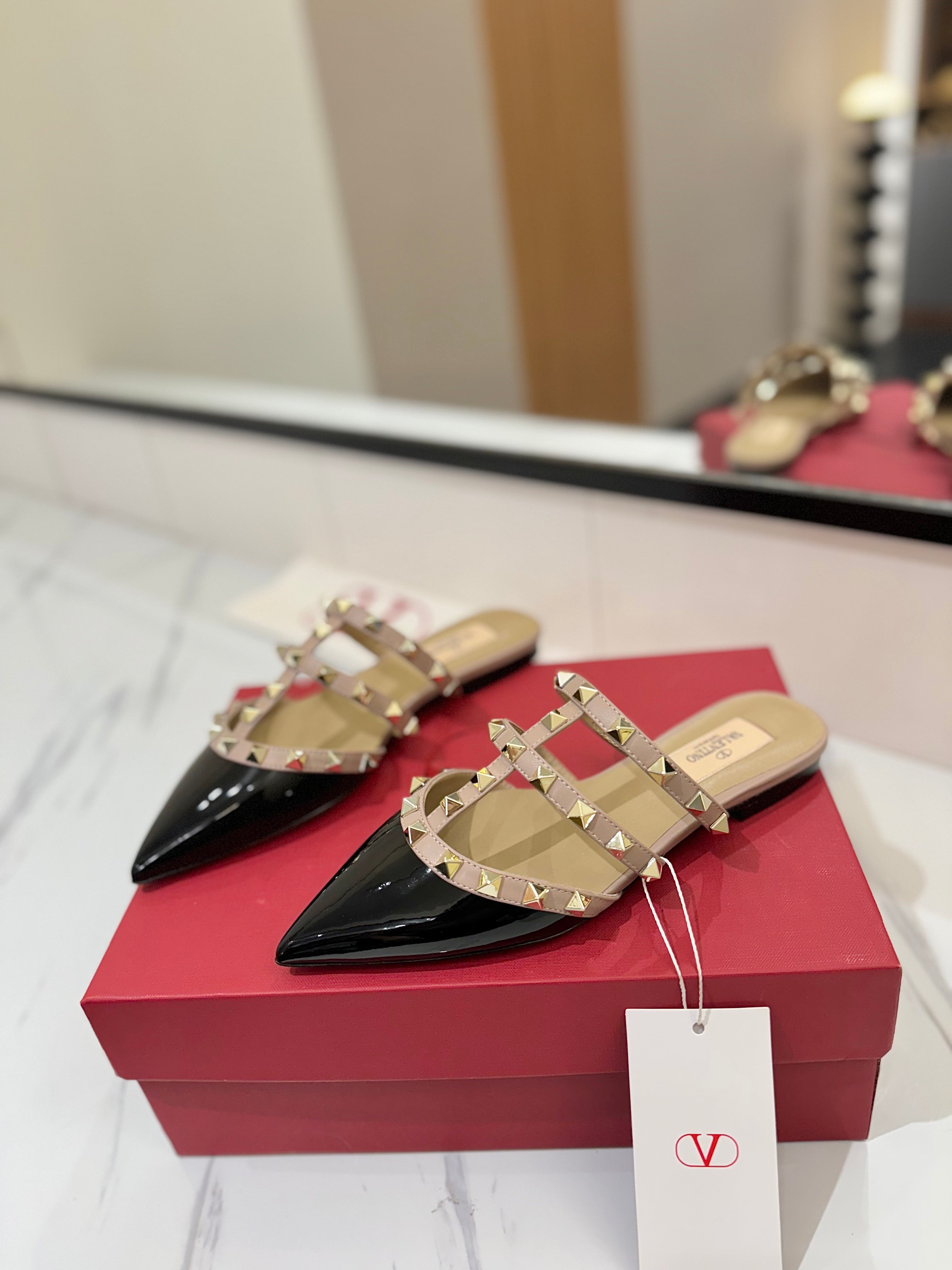 VALENTINO 26S STUDDED FLAT MULES IN BLACK PATENT CALFSKIN