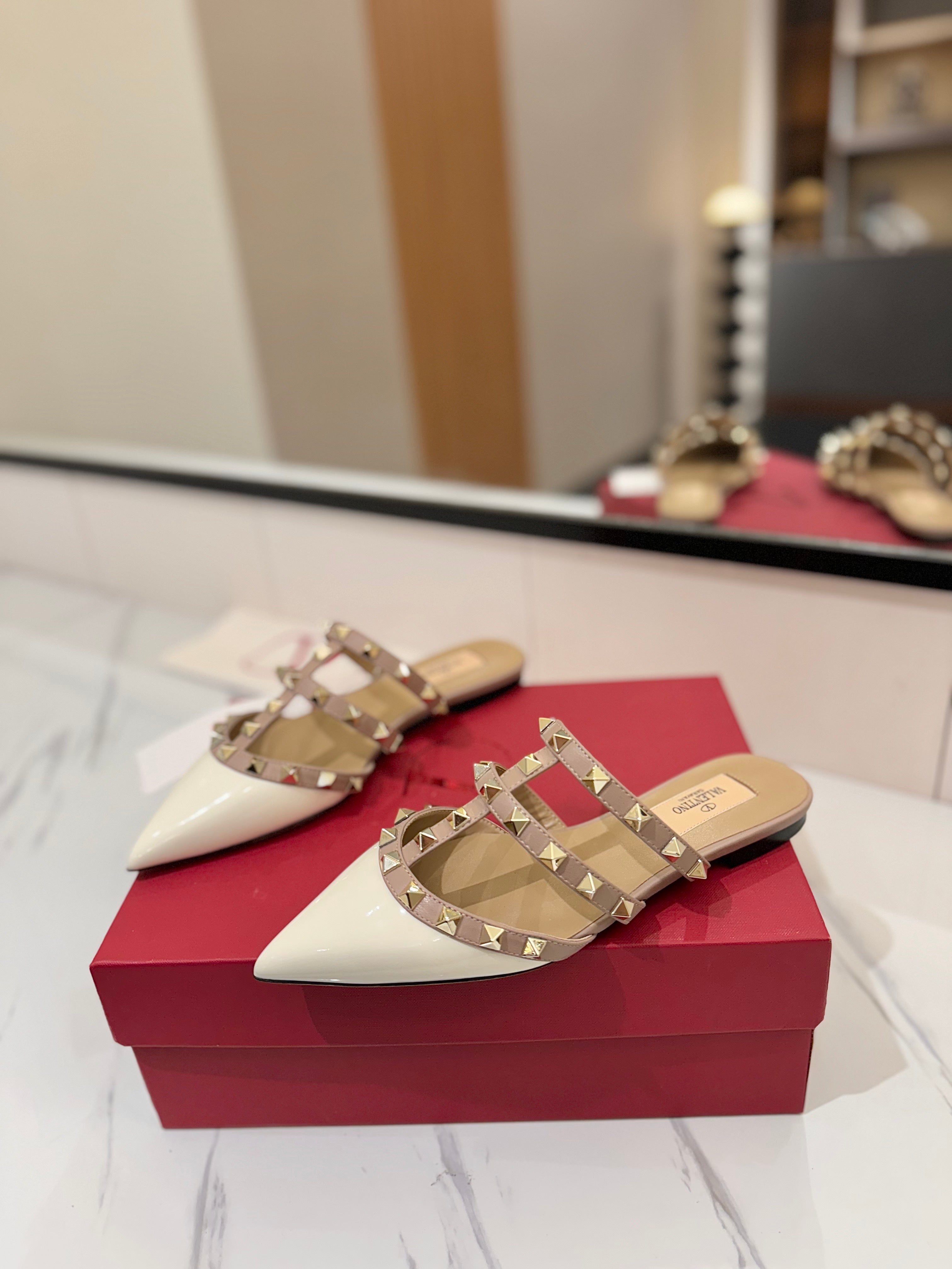 VALENTINO 26S STUDDED FLAT MULES IN WHITE PATENT CALFSKIN