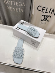 LOEWE 26S PETAL ANAGRAM SLIDE IN LIGHT BLUE CALFSKIN