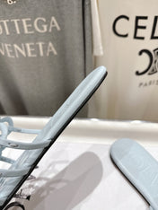 LOEWE 26S PETAL ANAGRAM SLIDE IN LIGHT BLUE CALFSKIN
