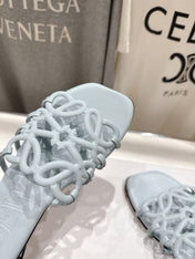 LOEWE 26S PETAL ANAGRAM SLIDE IN LIGHT BLUE CALFSKIN