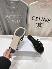 LOEWE 26S PETAL ANAGRAM SLIDE IN BLACK PATENT CALFSKIN