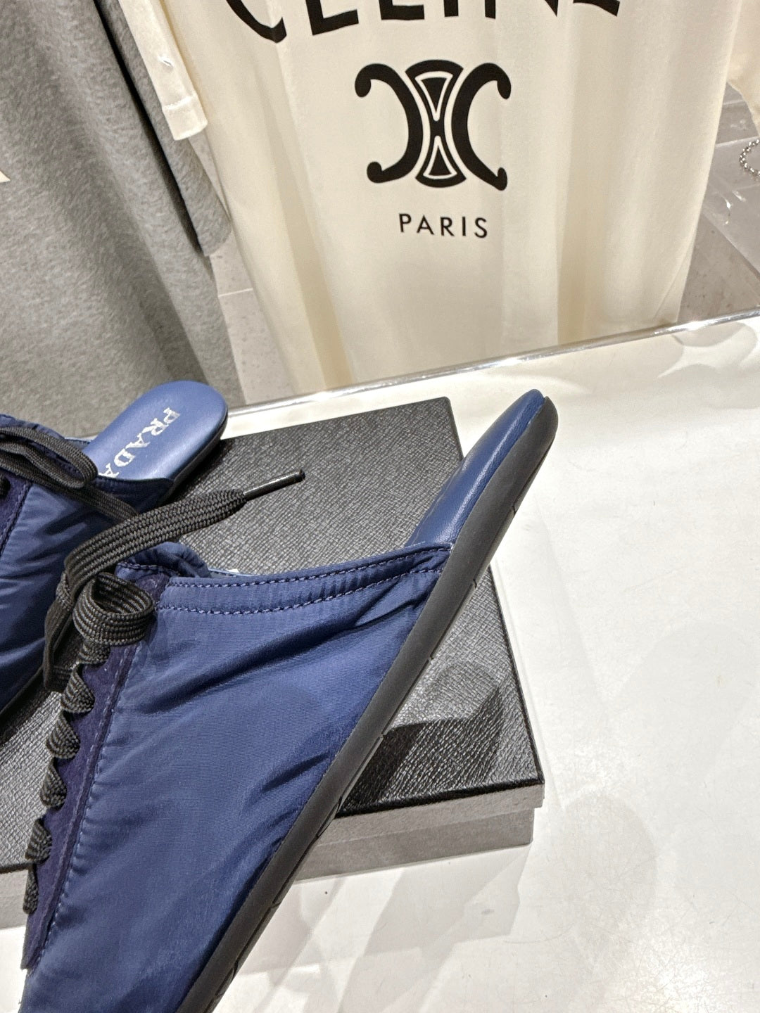 PRADA 25S MULES IN DARK BLUE WITH METAL TOECAP
