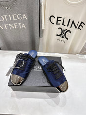 PRADA 25S MULES IN DARK BLUE WITH METAL TOECAP