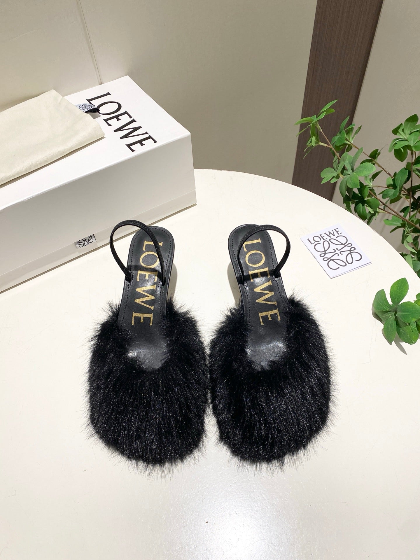 LOEWE 26S OPEN-BACK HIGH HEELS 60MM IN BLACK CALFSKIN WITH FUR