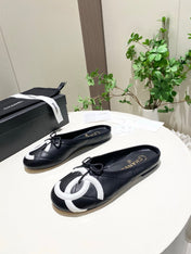 CHANEL 26S FLAT MULES IN BLACK LAMBSKIN