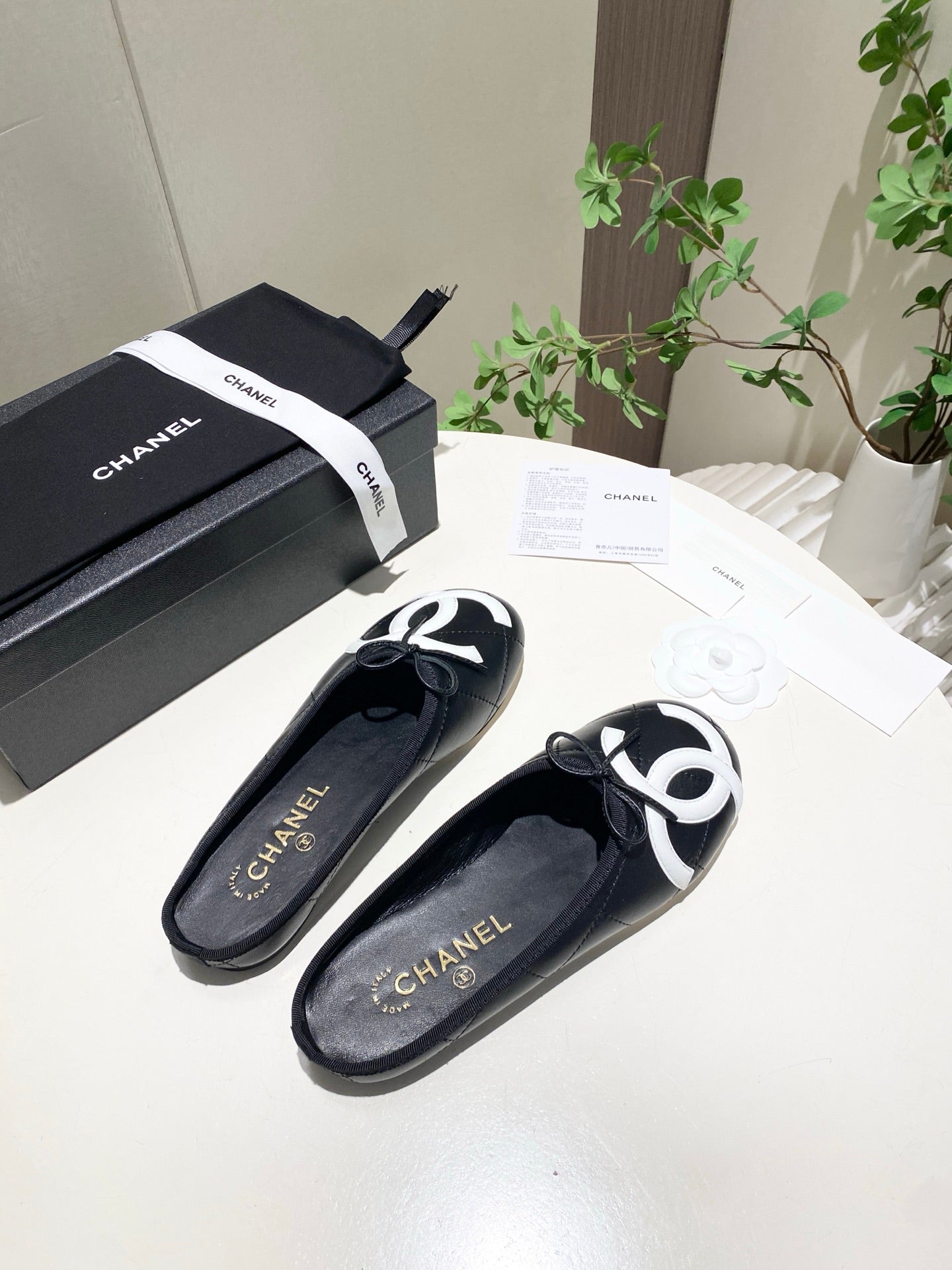 CHANEL 26S FLAT MULES IN BLACK LAMBSKIN