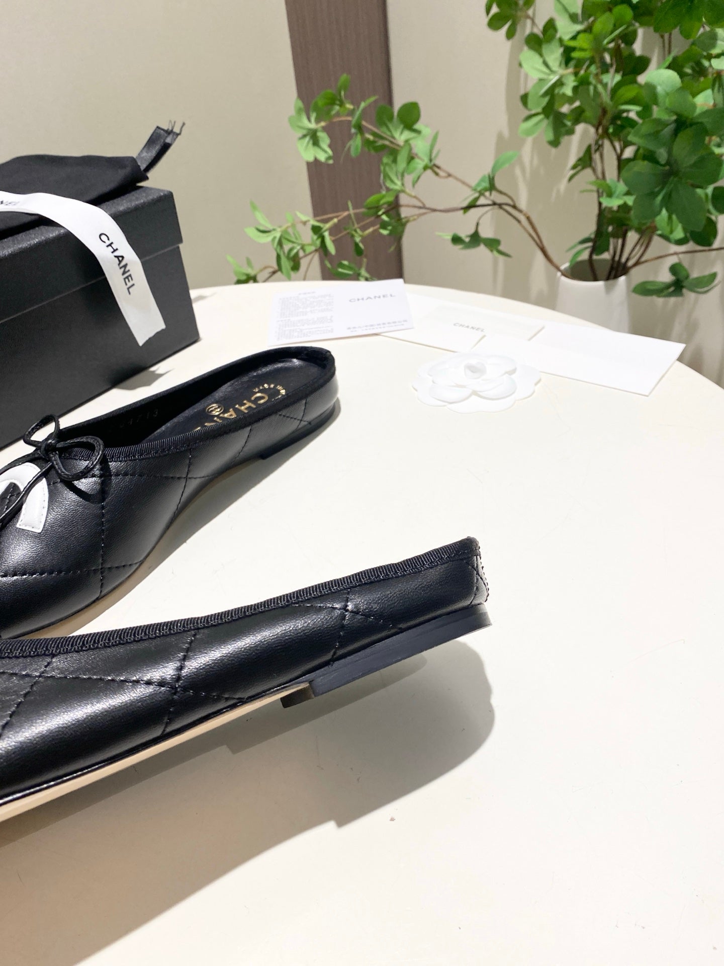 CHANEL 26S FLAT MULES IN BLACK LAMBSKIN