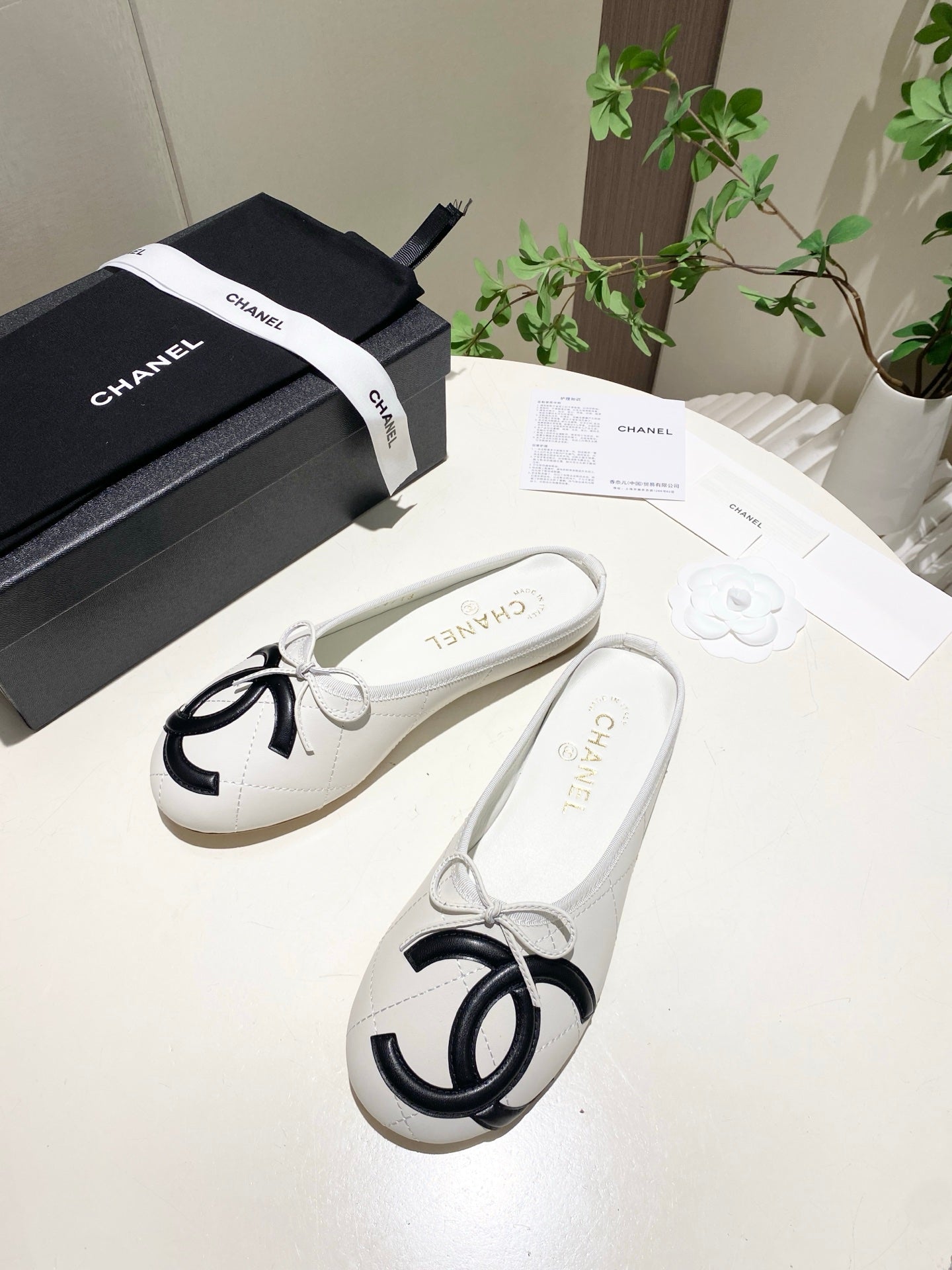 CHANEL 26S FLAT MULES IN WHITE LAMBSKIN
