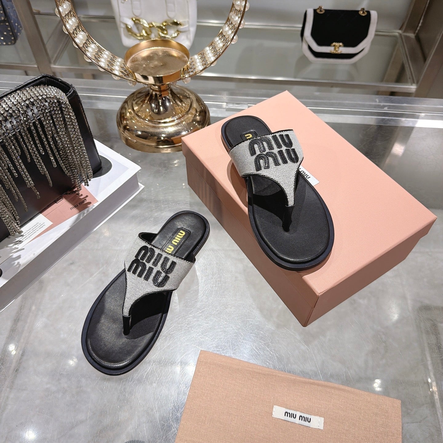 MIUMIU 26S THONG SANDALS IN WHITE CANVAS AND BLACK CALFSKIN LOGO
